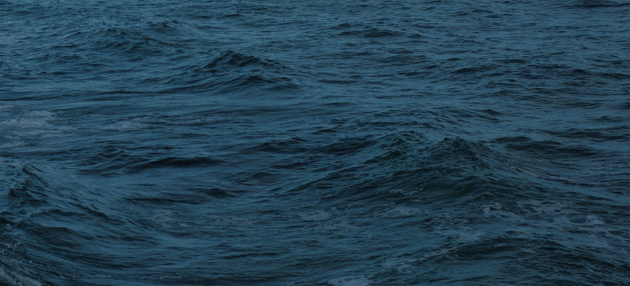 Deep blue open sea at dusk